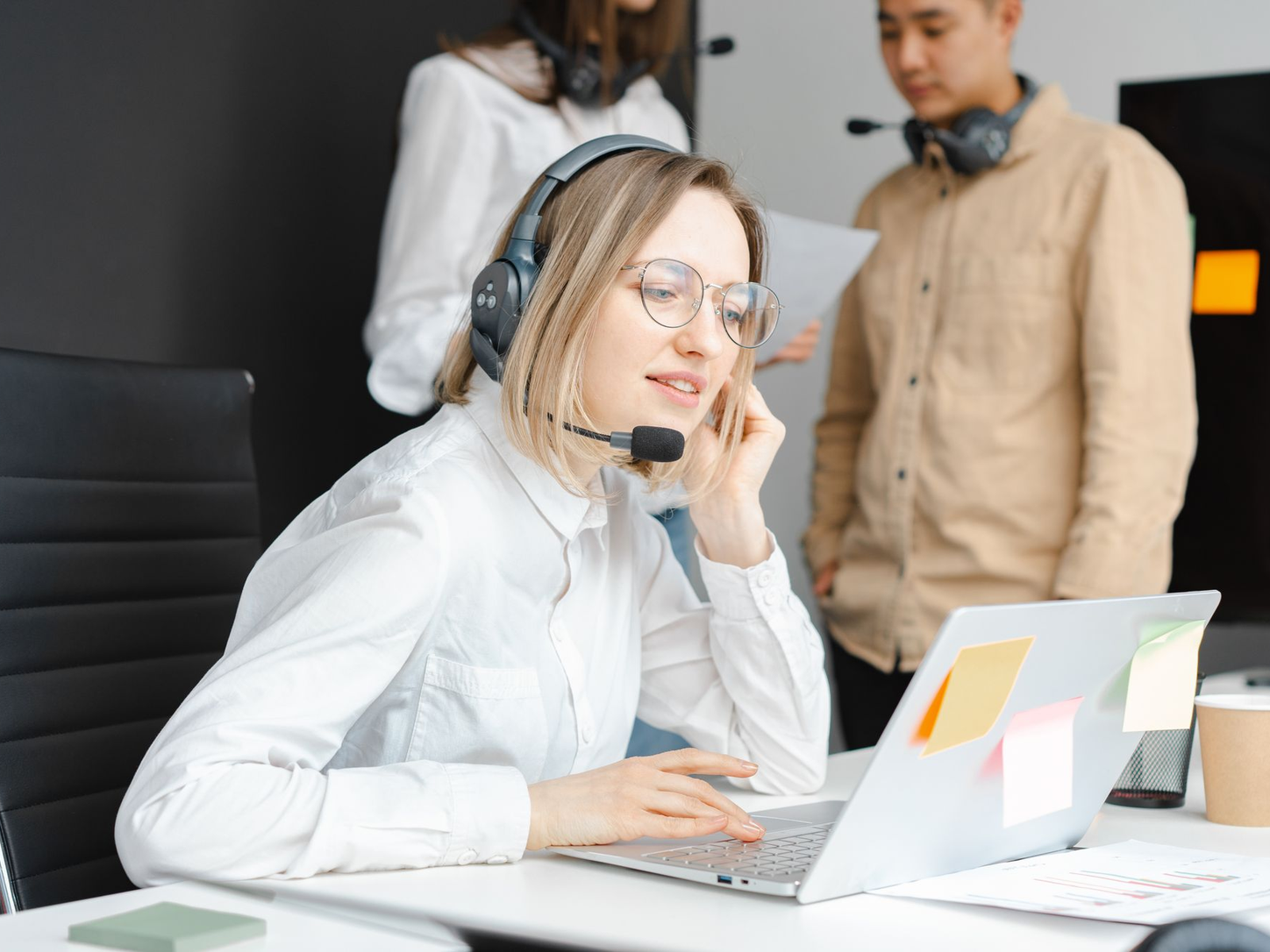 Yatosha support specialists collaborating at their desks